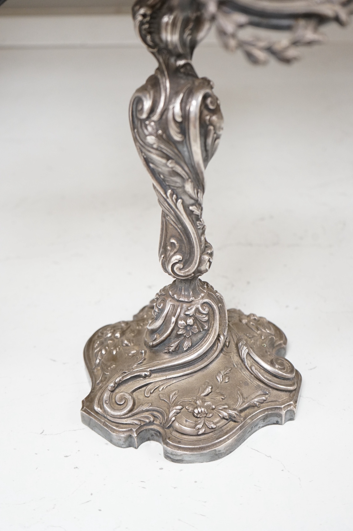 A pair of silver plated Rococo style six branch, seven light candelabra, 49cm. Condition - fair to good